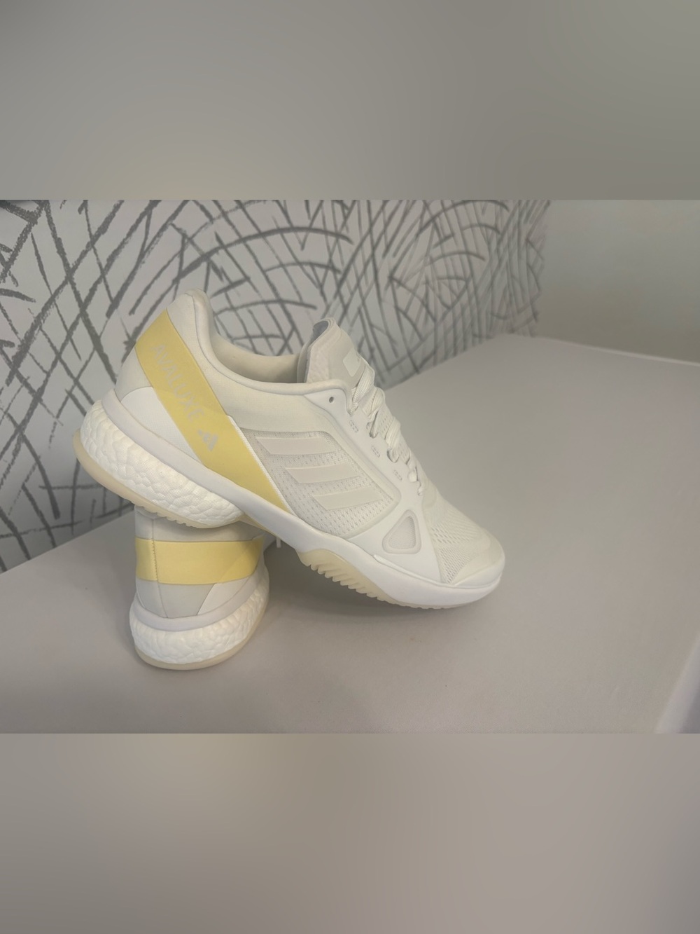 adidas Avaluxe tennis shoes in white with subtle pastel yellow accents. JQ7080